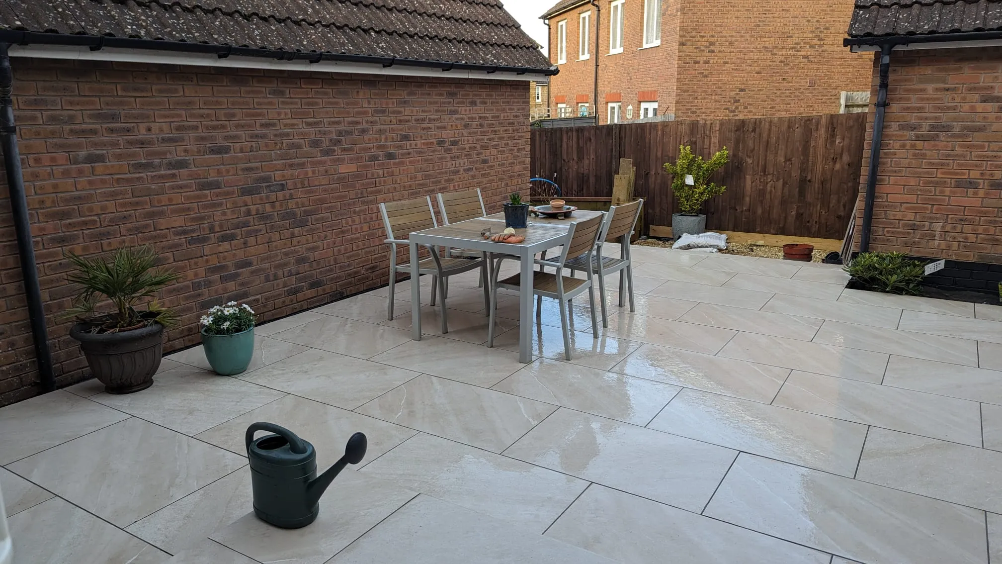 a patio with a table and chairs